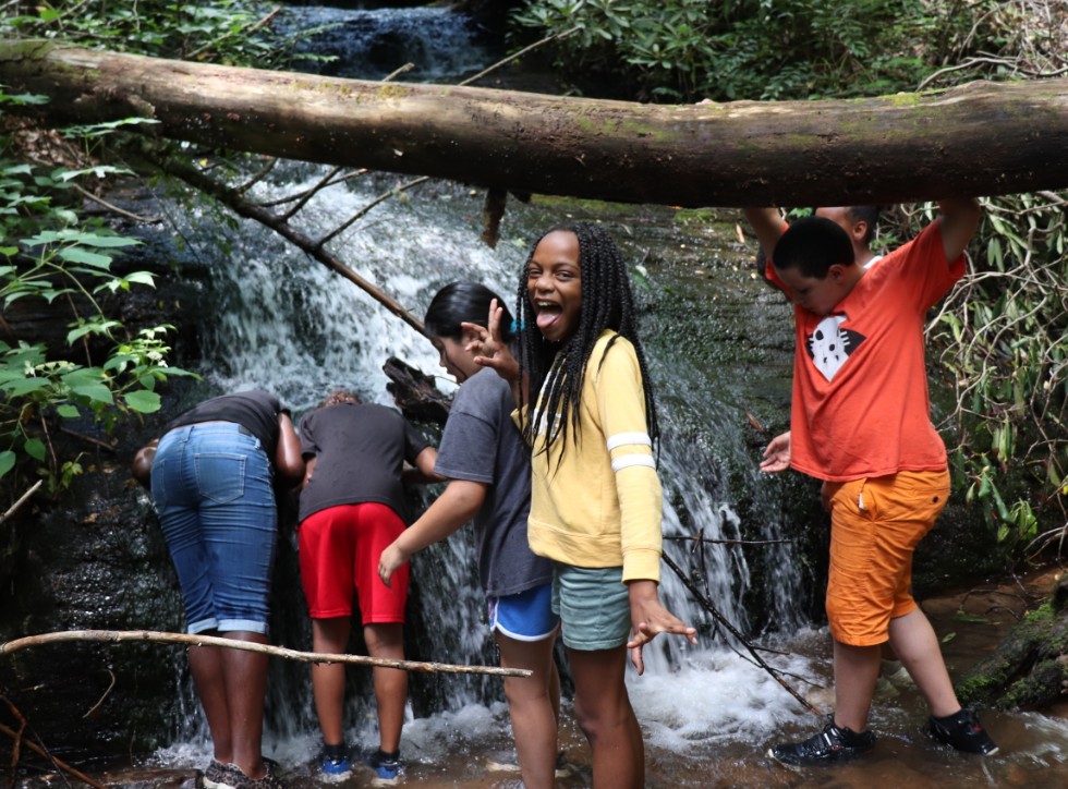 Rise & Shine scholars at waterfall